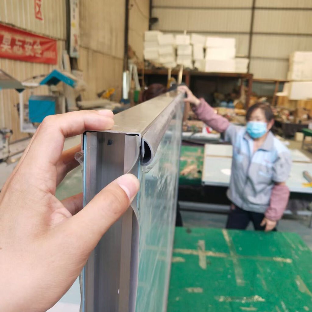 Skilled technician operating a CNC press brake machine at OSIDEK's facility, ensuring precision sheet metal fabrication for cleanroom steel doors and radiation shielding panels.