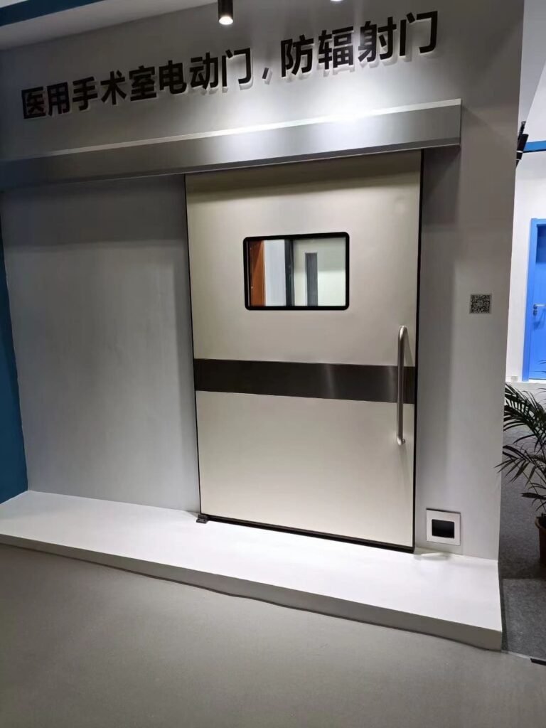 A real-world showroom display at the OSIDEK physical factory, featuring a heavy-duty automatic sliding door for radiation shielding engineering.